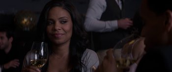 Movie still from “The Perfect Guy” (2015), directed by David M. Rosenthal – A person sitting at a table with a glass of wine; Close Up shot, Over the shoulder angle