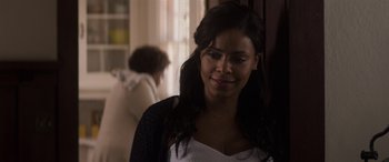 Movie still from “The Perfect Guy” (2015), directed by David M. Rosenthal – A woman standing next to a window in a room; Close Up shot, Over the shoulder angle
