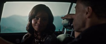 Movie still from “The Perfect Guy” (2015), directed by David M. Rosenthal – A woman sitting in the back seat of a car while a man takes a picture; Close Up shot, Over the shoulder angle