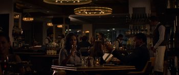 Movie still from “The Perfect Guy” (2015), directed by David M. Rosenthal – A group of people sitting at a table in a restaurant; Medium shot, Over the shoulder angle