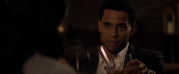 Movie still from “The Perfect Guy” (2015), directed by David M. Rosenthal – A person holding a glass of wine; Close Up shot, Over the shoulder angle
