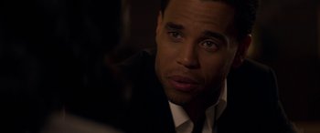 Movie still from “The Perfect Guy” (2015), directed by David M. Rosenthal – A person wearing a suit and tie; Close Up shot, Over the shoulder angle