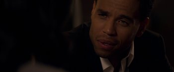 Movie still from “The Perfect Guy” (2015), directed by David M. Rosenthal – A person wearing a suit and tie; Close Up shot, Over the shoulder angle