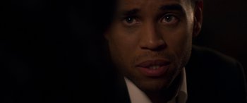 Movie still from “The Perfect Guy” (2015), directed by David M. Rosenthal – A person wearing a suit and tie; Close Up shot, Over the shoulder angle