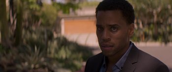 Movie still from “The Perfect Guy” (2015), directed by David M. Rosenthal – A person wearing a suit and tie; Close Up shot, Over the shoulder angle