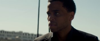 Movie still from “The Perfect Guy” (2015), directed by David M. Rosenthal – A person wearing a suit; Close Up shot, Over the shoulder angle