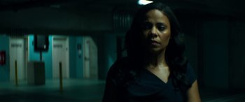 Movie still from “The Perfect Guy” (2015), directed by David M. Rosenthal – A woman standing in a dark room with her head turned to the side; Close Up shot, Low angle