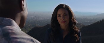 Movie still from “The Perfect Guy” (2015), directed by David M. Rosenthal – A beautiful woman with long black hair standing on top of a hill; Close Up shot, Over the shoulder angle