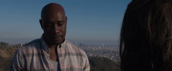 Movie still from “The Perfect Guy” (2015), directed by David M. Rosenthal – A man and a woman standing in front of a city skyline; Close Up shot, Over the shoulder angle