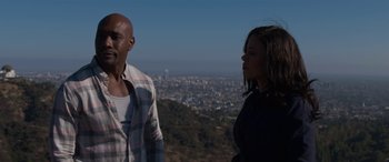 Movie still from “The Perfect Guy” (2015), directed by David M. Rosenthal – A man and a woman standing on top of a hill; Medium shot, Over the shoulder angle