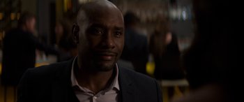 Movie still from “The Perfect Guy” (2015), directed by David M. Rosenthal – A person wearing a suit and tie; Close Up shot, Over the shoulder angle