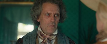 Movie still from “The Personal History of David Copperfield” (2019), directed by Armando Iannucci – A person wearing a neck tie; Close Up shot, Low angle