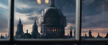 Movie still from “The Personal History of David Copperfield” (2019), directed by Armando Iannucci – An image of a building that looks like it is burning down; Extreme Wide shot, Low angle