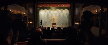 Movie still from “The Personal History of David Copperfield” (2019), directed by Armando Iannucci – A crowd of people sitting in front of a stage; Extreme Wide shot, High angle
