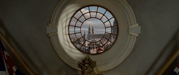 Movie still from “The Pirates! Band of Misfits” (2012), directed by Jeff Newitt – A circular window with a view of a city; Extreme Wide shot, Low angle