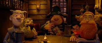 Movie still from “The Pirates! Band of Misfits” (2012), directed by Jeff Newitt – A man sitting at a table in a tavern; Medium shot, Low angle