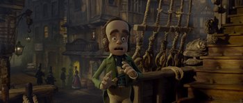 Movie still from “The Pirates! Band of Misfits” (2012), directed by Jeff Newitt – A cartoon of a man in a green jacket and brown pants; Medium shot, Low angle