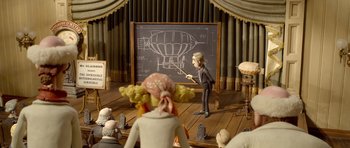 Movie still from “The Pirates! Band of Misfits” (2012), directed by Jeff Newitt – A man is standing in front of a chalkboard; Wide shot, High angle