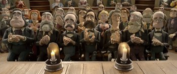 Movie still from “The Pirates! Band of Misfits” (2012), directed by Jeff Newitt – A group of people sitting in front of a table; Wide shot, Low angle