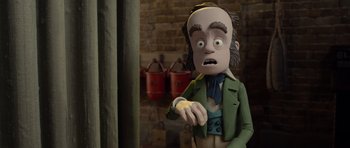 Movie still from “The Pirates! Band of Misfits” (2012), directed by Jeff Newitt – A creepy doll of a man with a surprised look on his face; Medium shot, Low angle