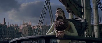 Movie still from “The Pirates! Band of Misfits” (2012), directed by Jeff Newitt – A statue of a man with a long beard; Wide shot, Over the shoulder angle