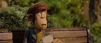 Movie still from “The Pirates! Band of Misfits” (2012), directed by Jeff Newitt – A monkey holding a piece of paper sitting on top of a bench; Close Up shot, Low angle