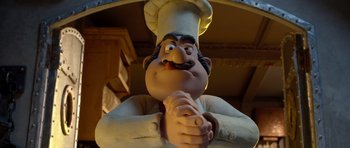 Movie still from “The Pirates! Band of Misfits” (2012), directed by Jeff Newitt – A statue of a man wearing a chef's hat; Close Up shot, Low angle