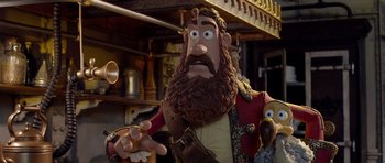 Movie still from “The Pirates! Band of Misfits” (2012), directed by Jeff Newitt – A statue of a man with a beard; Close Up shot, Over the shoulder angle