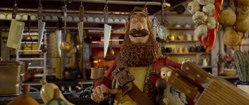 Movie still from “The Pirates! Band of Misfits” (2012), directed by Jeff Newitt – A statue of a man with a beard holding a knife; Medium shot, Low angle