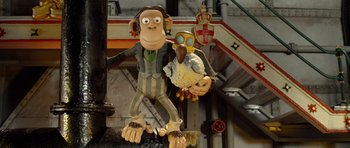 Movie still from “The Pirates! Band of Misfits” (2012), directed by Jeff Newitt – A statue of a monkey holding a bird; Medium shot, Low angle