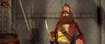 Movie still from “The Pirates! Band of Misfits” (2012), directed by Jeff Newitt – A man with a beard holding a knife; Close Up shot, Low angle