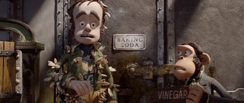 Movie still from “The Pirates! Band of Misfits” (2012), directed by Jeff Newitt – A statue of a man holding something in his hand; Medium shot, Low angle