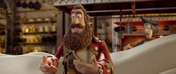 Movie still from “The Pirates! Band of Misfits” (2012), directed by Jeff Newitt – A statue of a man with a beard; Close Up shot, Over the shoulder angle