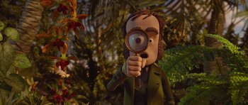 Movie still from “The Pirates! Band of Misfits” (2012), directed by Jeff Newitt – A cartoon character looking through a magnifying glass; Close Up shot, Over the shoulder angle