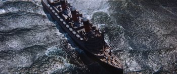 Movie still from “The Poseidon Adventure” (1972), directed by Ronald Neame – An aerial view of a boat in the water; Extreme Wide shot, Overhead angle