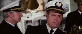 Movie still from “The Poseidon Adventure” (1972), directed by Ronald Neame – A person wearing a uniform; Close Up shot, Low angle