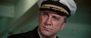 Movie still from “The Poseidon Adventure” (1972), directed by Ronald Neame – A person wearing a hat; Close Up shot, Low angle