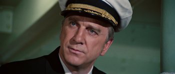 Movie still from “The Poseidon Adventure” (1972), directed by Ronald Neame – A person wearing a hat; Close Up shot, Low angle