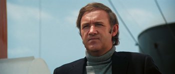 Movie still from “The Poseidon Adventure” (1972), directed by Ronald Neame – A person wearing a suit and tie; Close Up shot, Low angle