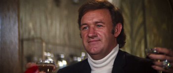 Movie still from “The Poseidon Adventure” (1972), directed by Ronald Neame – A person wearing a suit; Close Up shot, Low angle