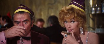 Movie still from “The Poseidon Adventure” (1972), directed by Ronald Neame – A man and a woman are sitting at a table; Close Up shot, Over the shoulder angle