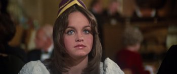 Movie still from “The Poseidon Adventure” (1972), directed by Ronald Neame – A person wearing a hat and looking at the camera; Close Up shot, Over the shoulder angle