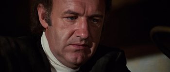 Movie still from “The Poseidon Adventure” (1972), directed by Ronald Neame – A man's face in a dark room; Close Up shot, Low angle