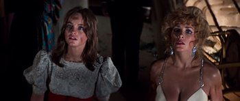 Movie still from “The Poseidon Adventure” (1972), directed by Ronald Neame – Two women are standing in a dark room; Close Up shot, Low angle
