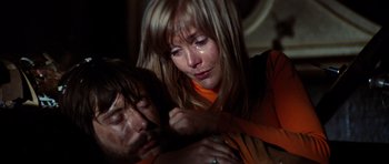 Movie still from “The Poseidon Adventure” (1972), directed by Ronald Neame – A man and a woman are crying in the dark; Close Up shot, High angle