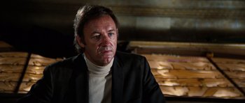 Movie still from “The Poseidon Adventure” (1972), directed by Ronald Neame – A person wearing a suit; Close Up shot, Low angle