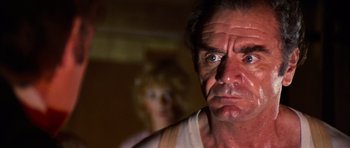 Movie still from “The Poseidon Adventure” (1972), directed by Ronald Neame – A person looking at the camera; Close Up shot, Low angle