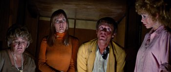 Movie still from “The Poseidon Adventure” (1972), directed by Ronald Neame – A man and a woman looking up at the ceiling; Medium shot, Low angle