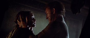 Movie still from “The Poseidon Adventure” (1972), directed by Ronald Neame – A man and a woman face to face in a dark room; Close Up shot, Over the shoulder angle