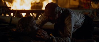 Movie still from “The Poseidon Adventure” (1972), directed by Ronald Neame – An older man and a younger woman in front of a fireplace; Close Up shot, Over the shoulder angle